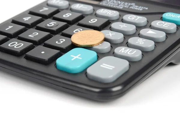 Calculadora y moneda — Foto de Stock