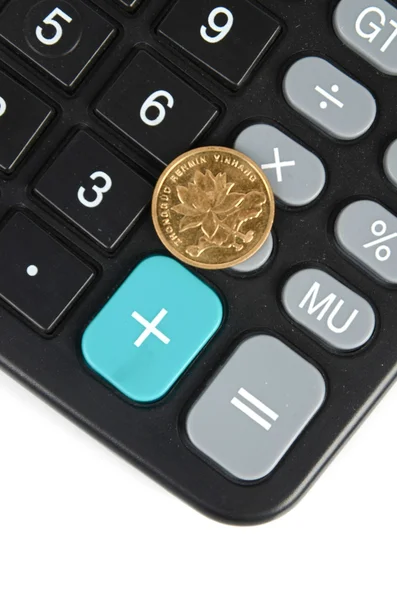 Calculadora e moeda — Fotografia de Stock