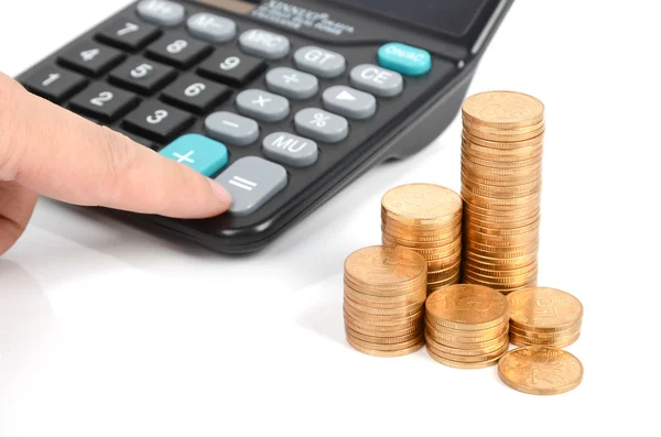 Kalkulačka a mince — Stock fotografie