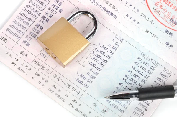 Bankbook and padlock with pen — Stock Photo, Image