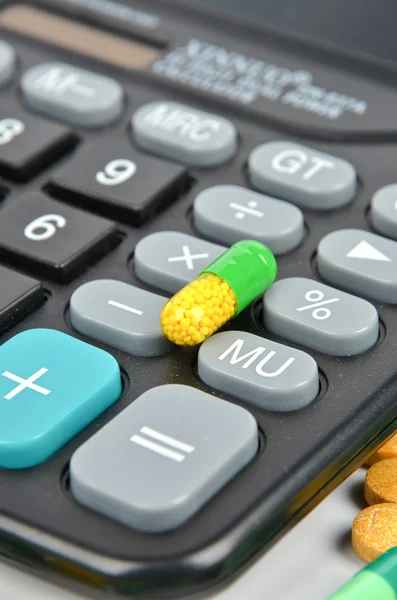 Medicine and calculator Stock Photo