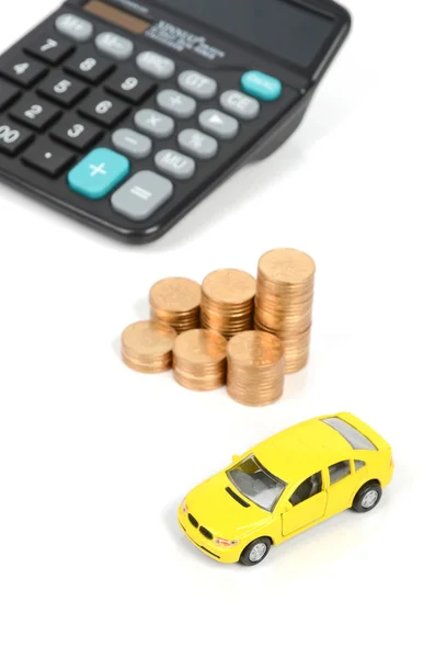Carro de brinquedo e moeda com calculadora — Fotografia de Stock