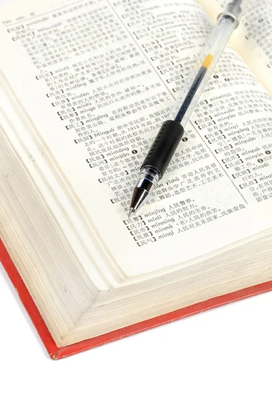 Pen and dictionary — Stock Photo, Image