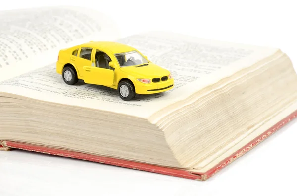 stock image Toy car and dictionary