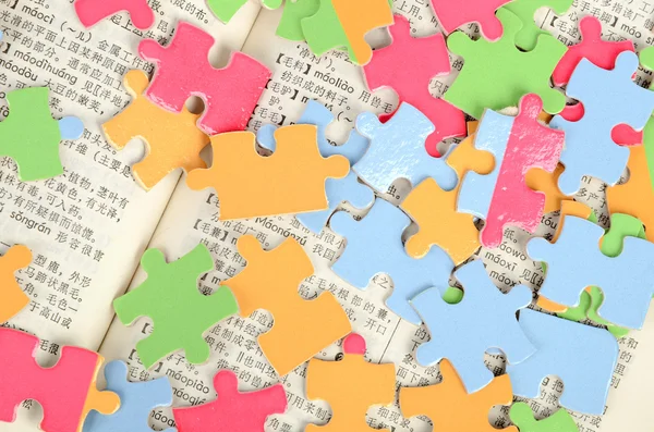 Puzzle and book — Stock Photo, Image