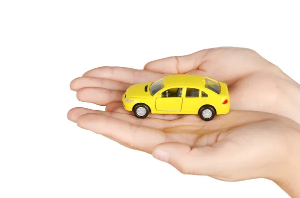 Speelgoed auto in de hand — Stockfoto