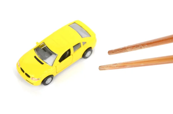 Oyuncak araba ve yemek çubukları — Stok fotoğraf