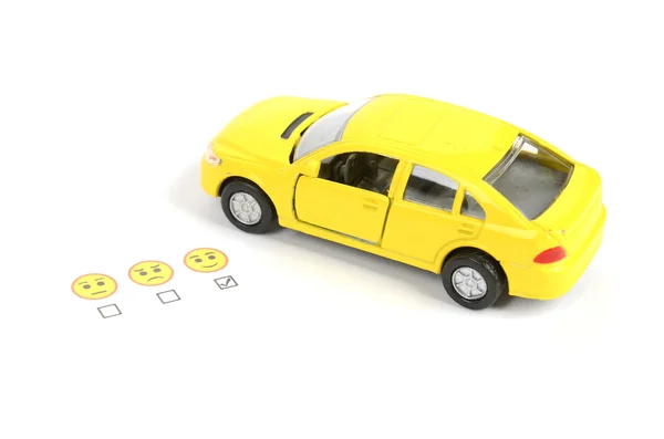 Toy car and emoticon — Stock Photo, Image