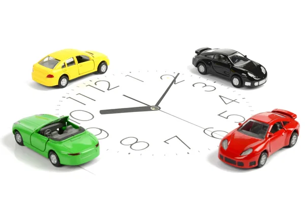 おもちゃの車と時計の顔 — ストック写真