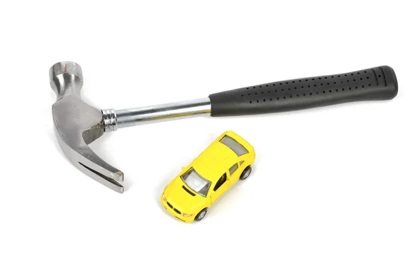 Hammer und Spielzeugauto — Stockfoto