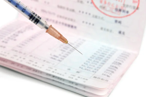 Passbook and syringe — Stock Photo, Image