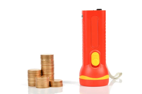 Taschenlampe und Münze — Stockfoto