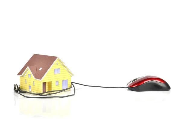 Modello casa e mouse del computer Immagine Stock