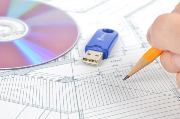 USB disk and DVD with blueprint Stock Photo