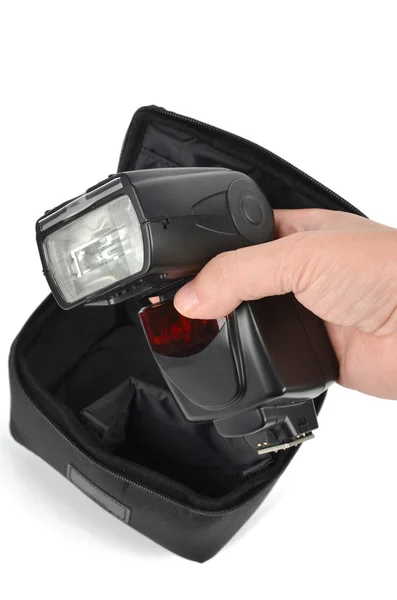 Camera flash and bag — Stock Photo, Image