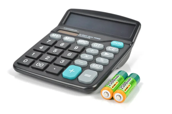 Батареи и калькулятор — стоковое фото