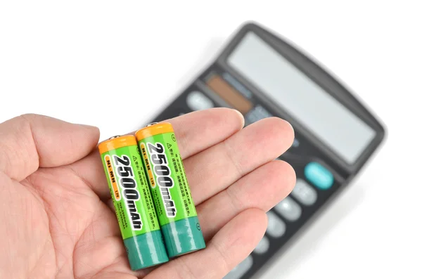 Батареи и калькулятор — стоковое фото