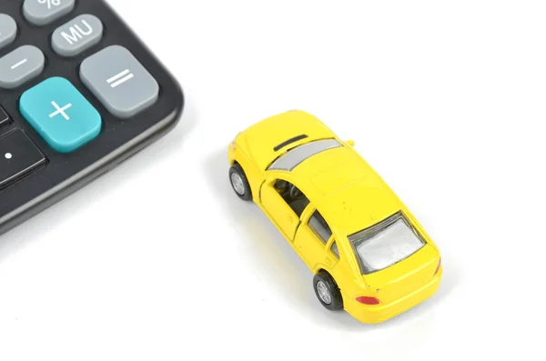 Speelgoedauto en rekenmachine — Stockfoto