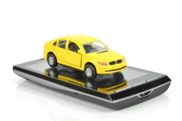 Slimme telefoon en speelgoed auto — Stockfoto