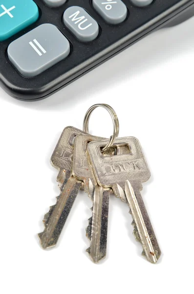 Calculadora e chave — Fotografia de Stock