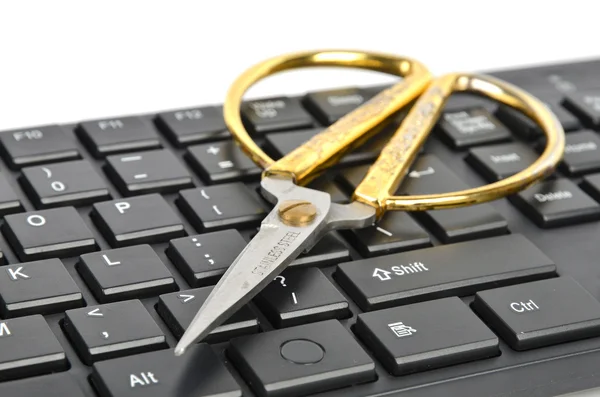 Ножницы и клавиатура — стоковое фото