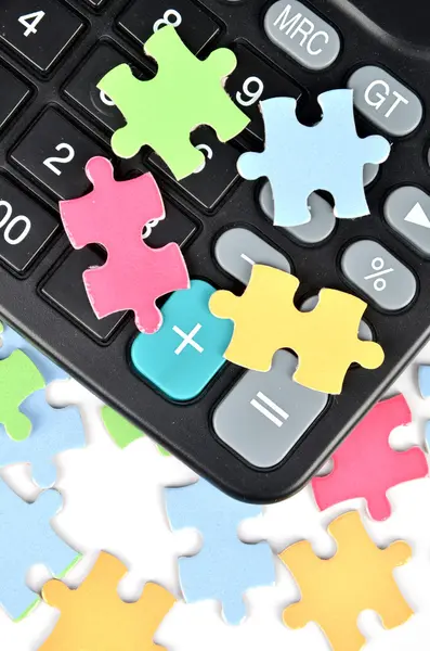 Puzzle and calculator — Stock Photo, Image