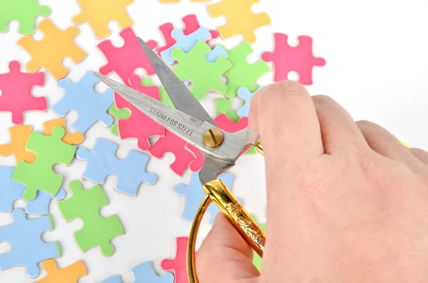 Puzzle and scissors — Stock Photo, Image