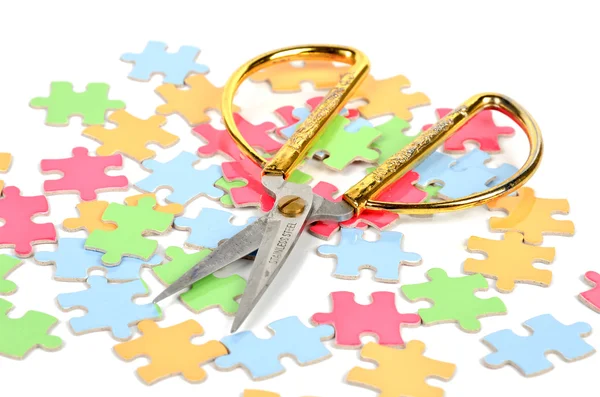 Puzzle and scissors — Stock Photo, Image