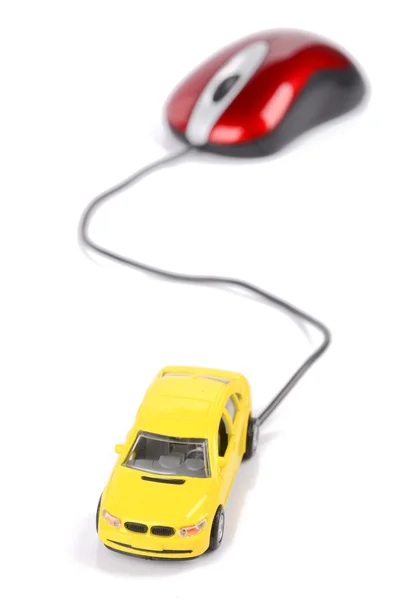 Компьютерная мышь и игрушечный автомобиль — стоковое фото