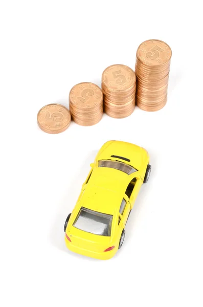Carro de brinquedo e moeda — Fotografia de Stock