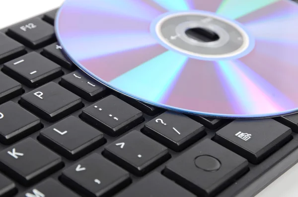 DVD and computer keyboard — Stock Photo, Image