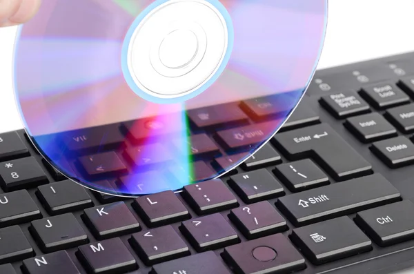 DVD and computer keyboard — Stock Photo, Image