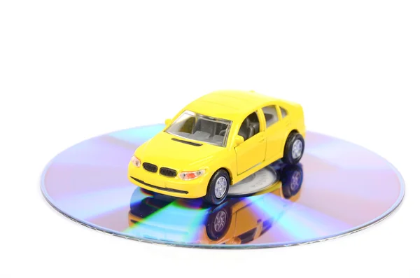 Игрушечный автомобиль и DVD — стоковое фото