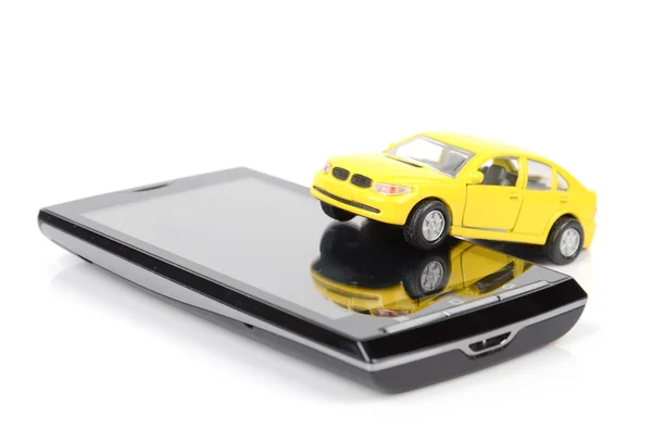 Oyuncak araba ve akıllı telefon — Stok fotoğraf