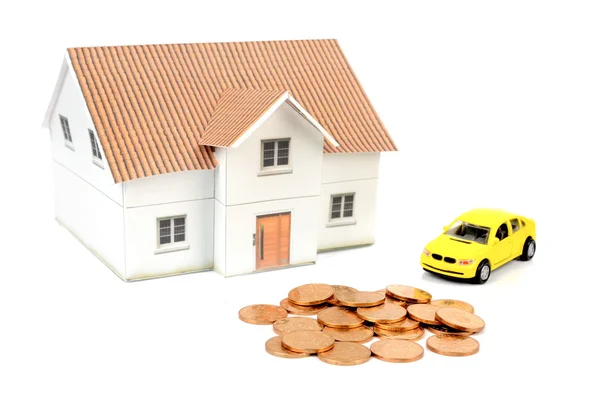 Toy car and house with coins — Stock Photo, Image