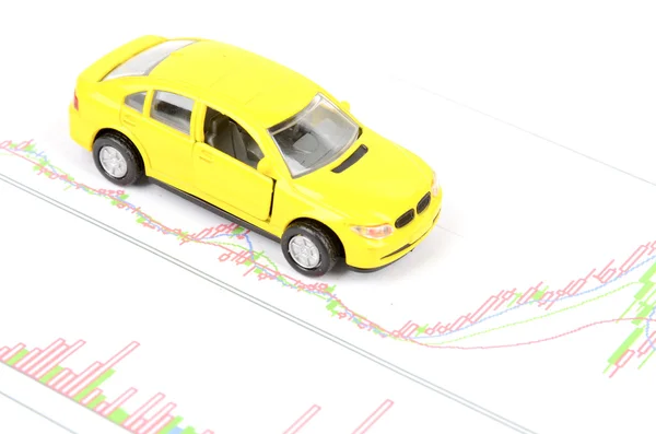 Spielzeugauto und Finanzgrafik — Stockfoto