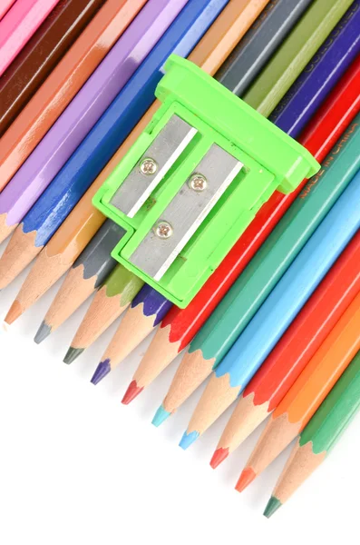 Color pencils and sharpener Royalty Free Stock Images