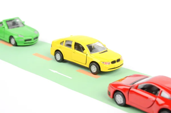 Іграшкові автомобілі на дорозі — стокове фото