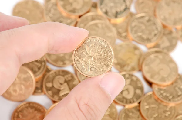 Monedas de oro sobre fondo blanco — Foto de Stock