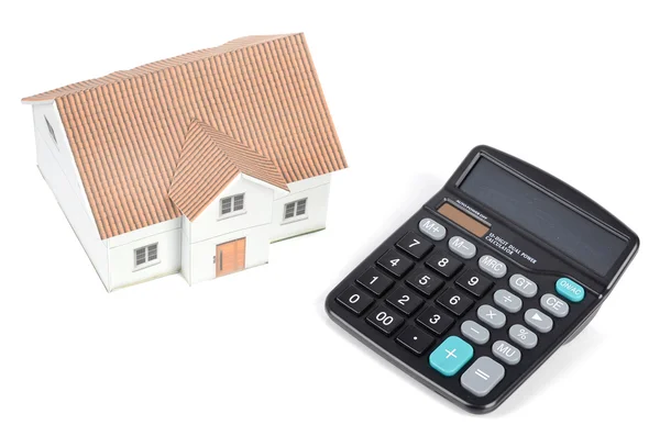 Calculator and model house — Stock Photo, Image