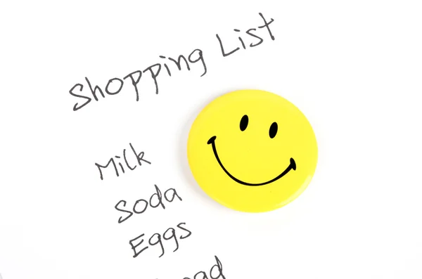 Λίστα για ψώνια και χαμογελαστό πρόσωπο — Φωτογραφία Αρχείου