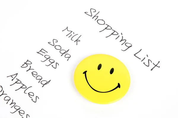 Shopping list and smiling face — Stock Photo, Image