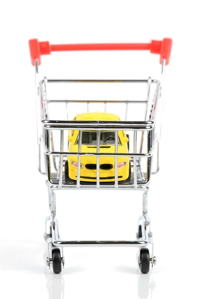 Shopping cart and toy car — Stock Photo, Image