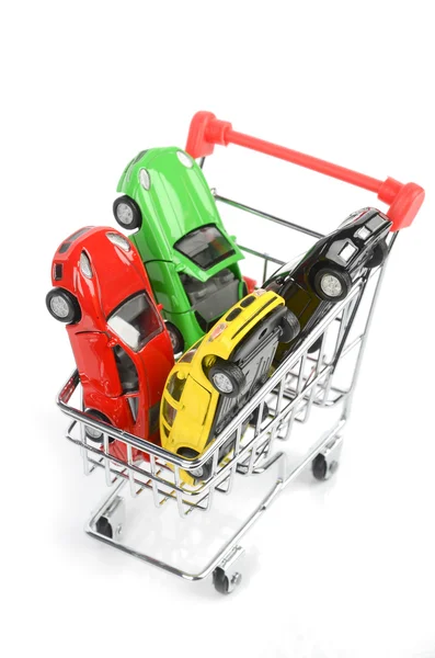 Carrinho de compras e carro de brinquedo — Fotografia de Stock