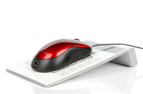 Компьютерная мышь и калькулятор — стоковое фото