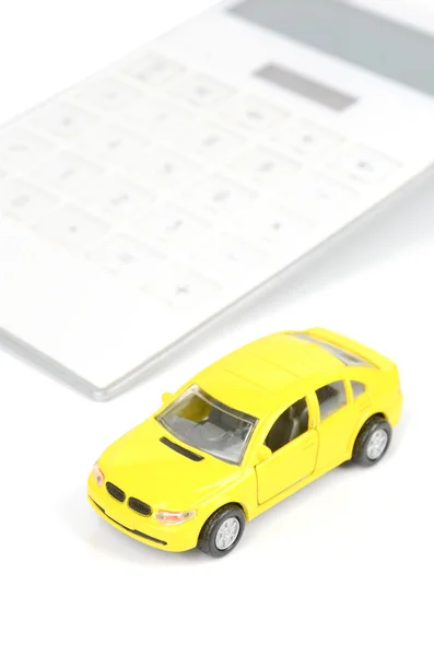 Carro de brinquedo e calculadora — Fotografia de Stock