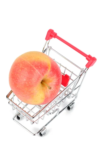 Apple and shopping cart — Stock Photo, Image