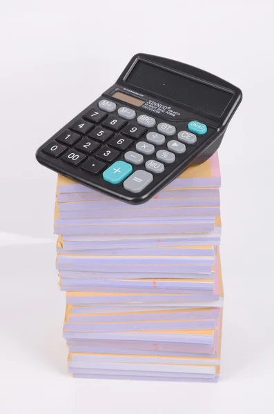 Montón de documentos y calculadora — Foto de Stock