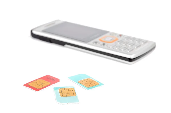 SIM karty a mobilní telefon — Stock fotografie