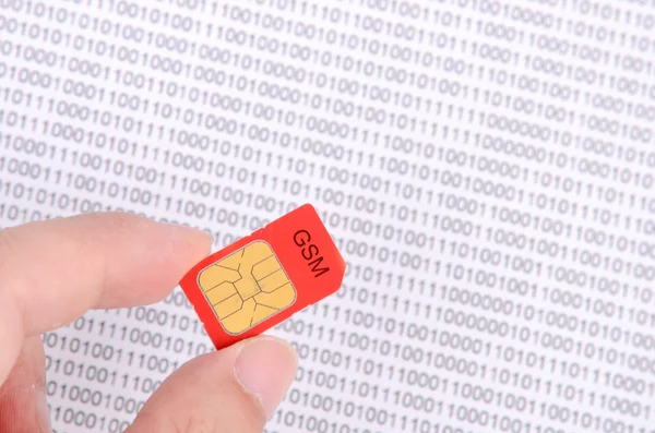 Sim card and binary code — Stock Photo, Image